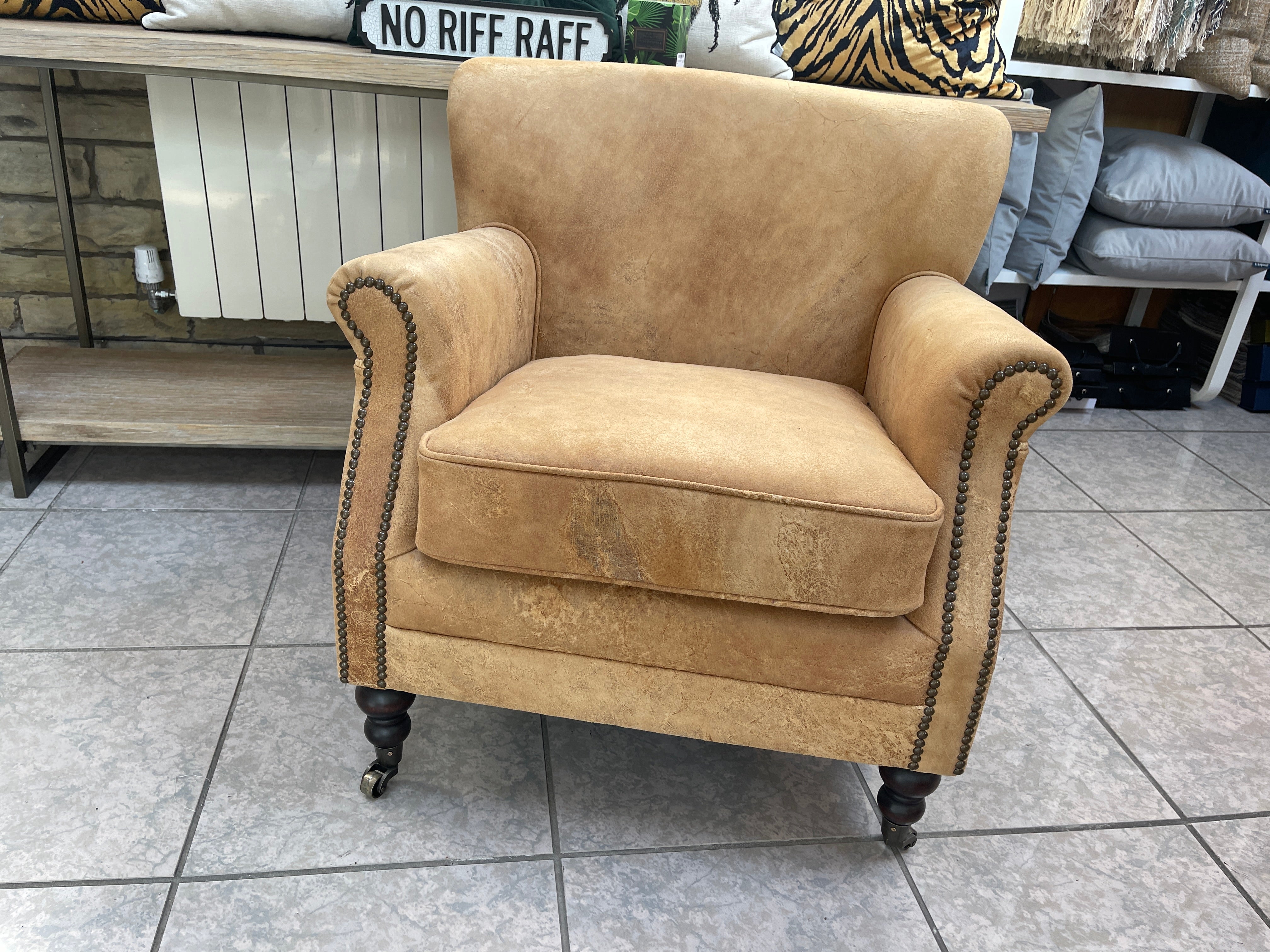 COACH HOUSE Vintage Chamois Tan Leather accent chair on castors with studs - pair available